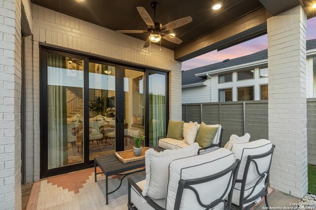 12376 Goulding, San Antonio, TX 78254 - patio terrace at dusk featuring a ceiling fan and an outdoor hangout area