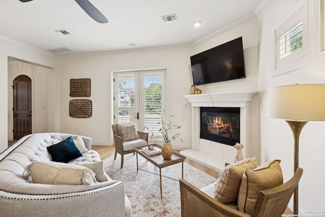 172 Katherine Ct Unit 1, San Antonio, TX 78209 - living area with ceiling fan, wood finished floors, crown molding, baseboards, and a fireplace