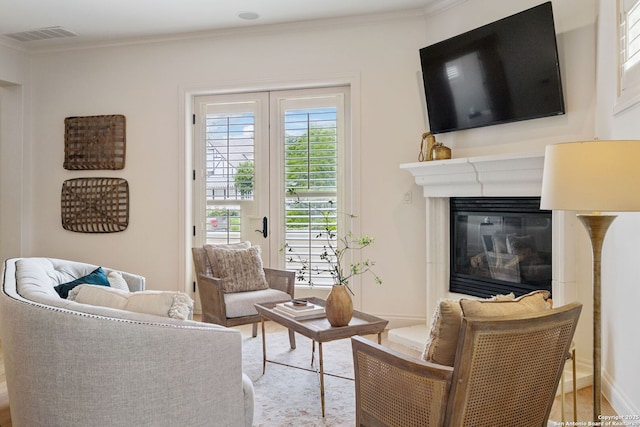 172 Katherine Ct Unit 1, San Antonio, TX 78209 - living area featuring ornamental molding, a glass covered fireplace, and wood finished floors