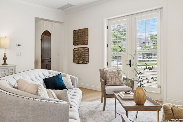 172 Katherine Ct Unit 1, San Antonio, TX 78209 - living room with light wood-style flooring, baseboards, ornamental molding, and arched walkways