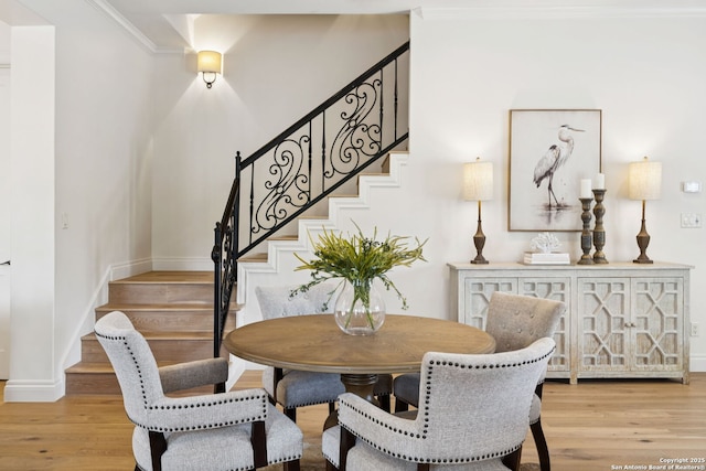 172 Katherine Ct Unit 1, San Antonio, TX 78209 - dining space with stairs, light wood-type flooring, baseboards, and ornamental molding