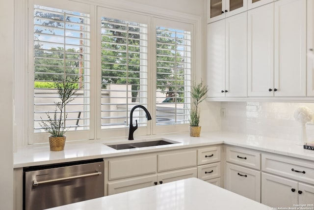 172 Katherine Ct Unit 1, San Antonio, TX 78209 - kitchen featuring dishwasher, a sink, white cabinetry, and glass insert cabinets