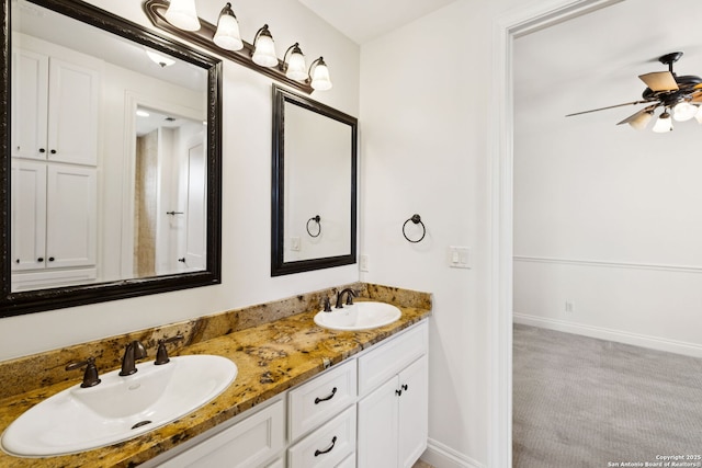172 Katherine Ct Unit 1, San Antonio, TX 78209 - full bath with double vanity, a ceiling fan, and baseboards