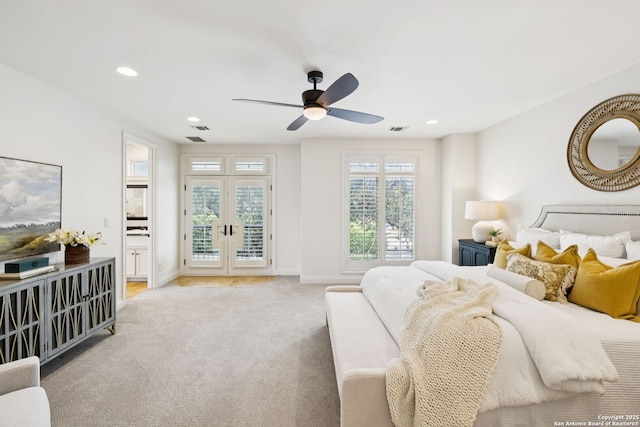 172 Katherine Ct Unit 1, San Antonio, TX 78209 - bedroom with access to exterior, light carpet, multiple windows, recessed lighting, and baseboards