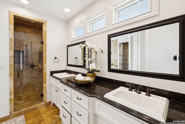 172 Katherine Ct Unit 1, San Antonio, TX 78209 - bathroom featuring a shower stall, double vanity, and recessed lighting
