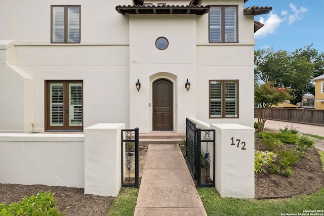 172 Katherine Ct Unit 1, San Antonio, TX 78209 - view of front of house with stucco siding and a fenced front yard