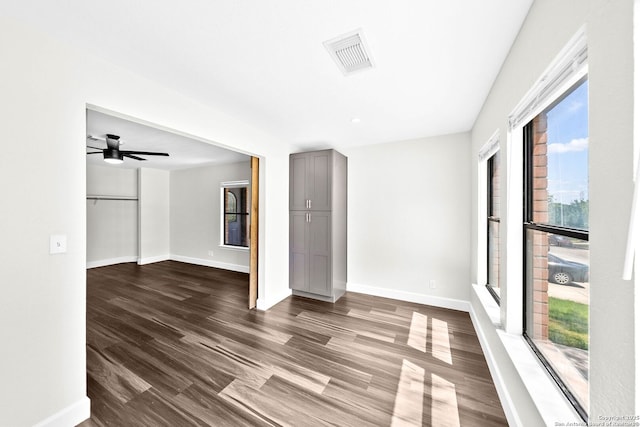 15831 Colton Wl, San Antonio, TX 78247 - spare room with baseboards, dark wood-type flooring, and a ceiling fan