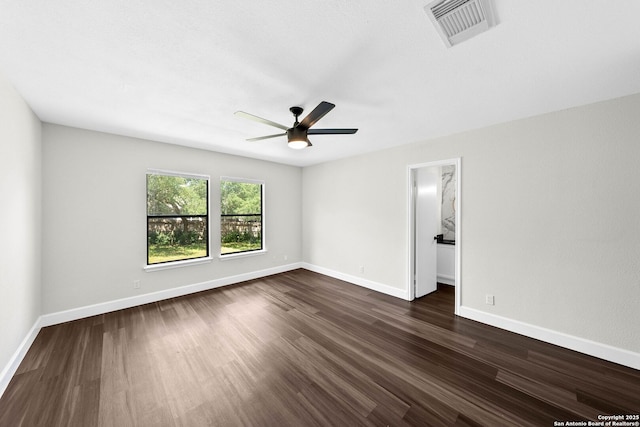 15831 Colton Wl, San Antonio, TX 78247 - spare room featuring dark wood-type flooring, a ceiling fan, and baseboards