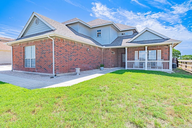 132 Las Palomas Ln, Vernia, TX 78121 - view of front of house featuring brick siding, a front yard, and roof with shingles