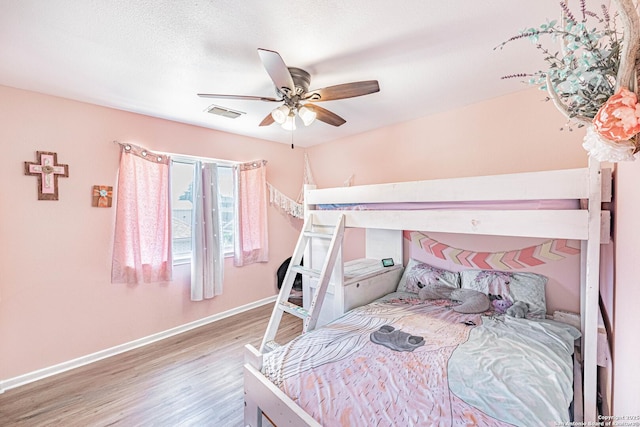 132 Las Palomas Ln, Vernia, TX 78121 - bedroom with wood finished floors, baseboards, and a ceiling fan