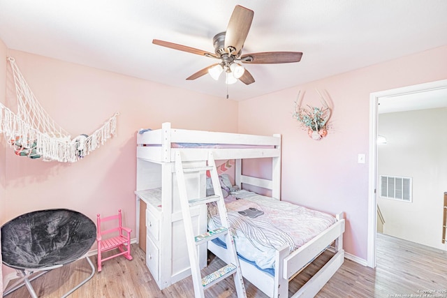 132 Las Palomas Ln, Vernia, TX 78121 - bedroom featuring light wood finished floors, baseboards, and a ceiling fan