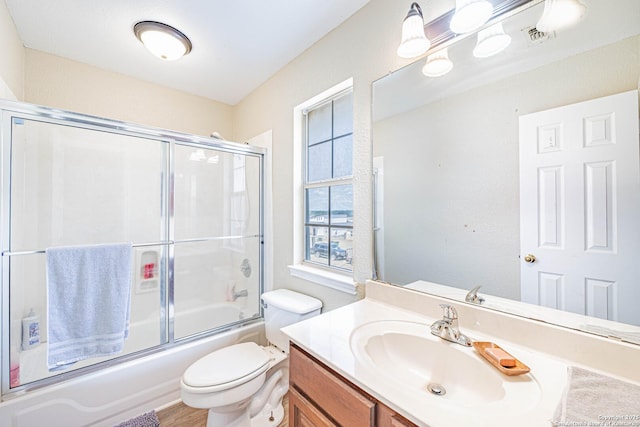 132 Las Palomas Ln, Vernia, TX 78121 - full bathroom with vanity, bath / shower combo with glass door, and toilet