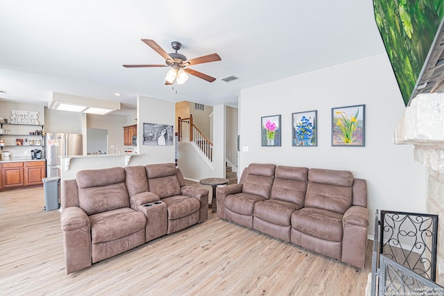 132 Las Palomas Ln, Vernia, TX 78121 - living room with light wood-type flooring, ceiling fan, and stairs