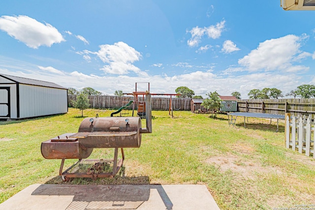 132 Las Palomas Ln, Vernia, TX 78121 - view of yard featuring a trampoline and a playground