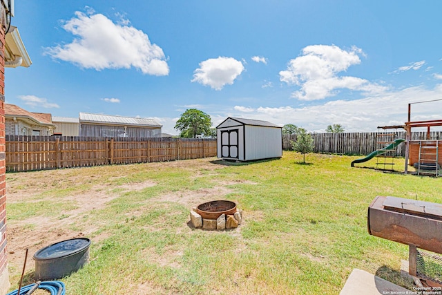 132 Las Palomas Ln, Vernia, TX 78121 - view of yard featuring a playground and a fire pit