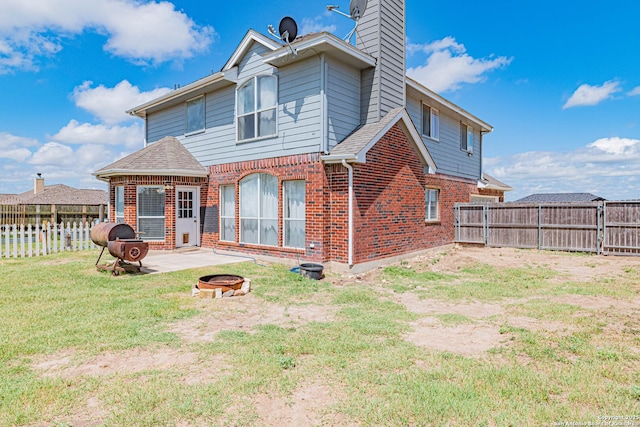 132 Las Palomas Ln, Vernia, TX 78121 - rear view of property featuring an outdoor fire pit, brick siding, a patio, and a chimney