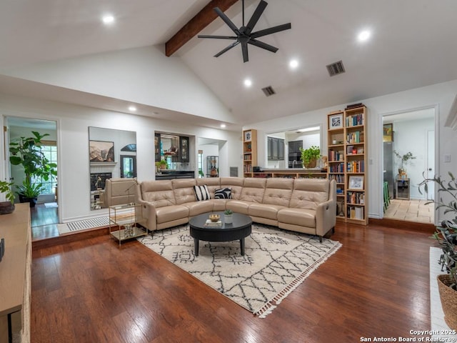 120 Spanish Oak Trl, Floresville, TX 78114 - living room featuring a ceiling fan, beam ceiling, wood finished floors, high vaulted ceiling, and a fireplace