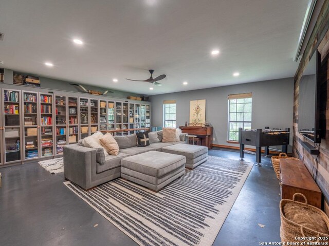 120 Spanish Oak Trl, Floresville, TX 78114 - living area featuring finished concrete floors, recessed lighting, and a ceiling fan