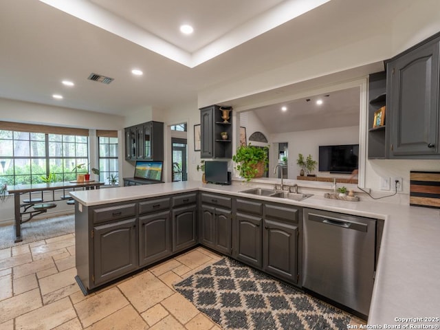 120 Spanish Oak Trl, Floresville, TX 78114 - kitchen featuring open shelves, dishwasher, a sink, light countertops, and a peninsula