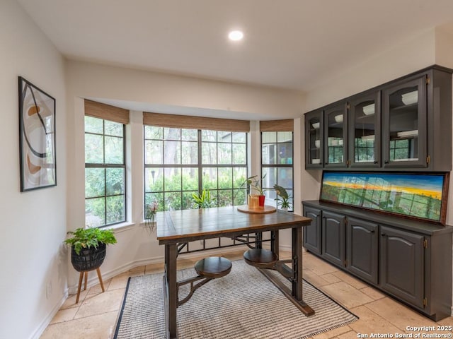 120 Spanish Oak Trl, Floresville, TX 78114 - home office featuring stone tile floors, baseboards, and recessed lighting