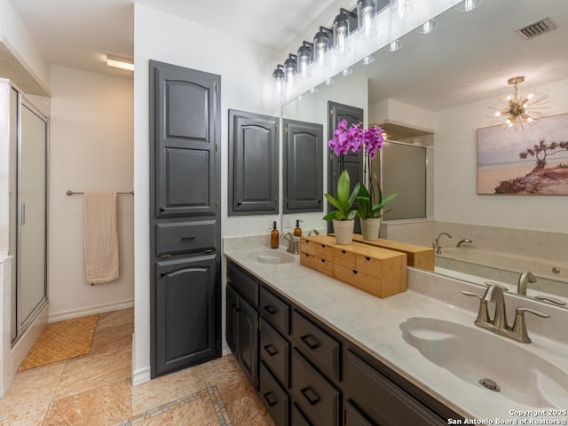 120 Spanish Oak Trl, Floresville, TX 78114 - full bathroom with double vanity, a shower stall, baseboards, a bath, and tile patterned flooring