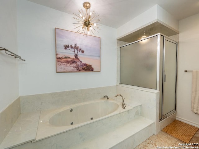 120 Spanish Oak Trl, Floresville, TX 78114 - bathroom featuring a chandelier, a shower stall, and a tub with jets