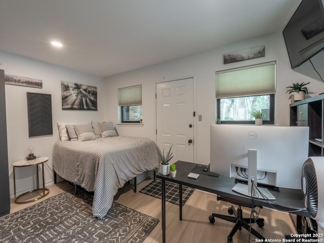 120 Spanish Oak Trl, Floresville, TX 78114 - bedroom with wood finished floors, an office area, and recessed lighting
