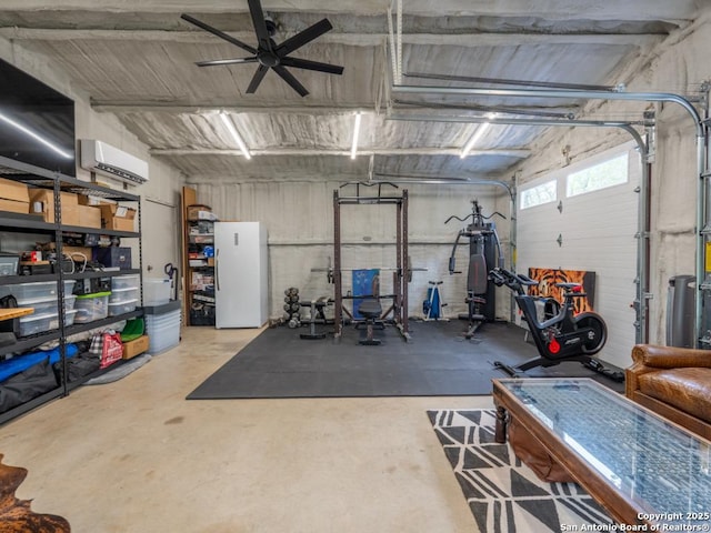 120 Spanish Oak Trl, Floresville, TX 78114 - garage with freestanding refrigerator, a wall mounted AC, and a ceiling fan