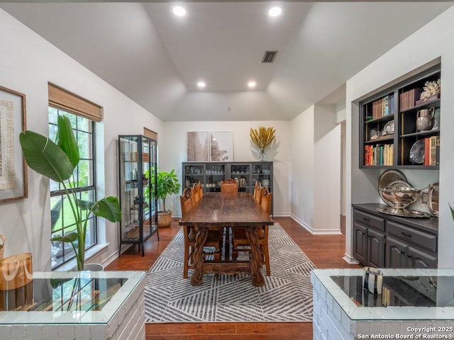 120 Spanish Oak Trl, Floresville, TX 78114 - dining area featuring dark wood finished floors, lofted ceiling, recessed lighting, and baseboards