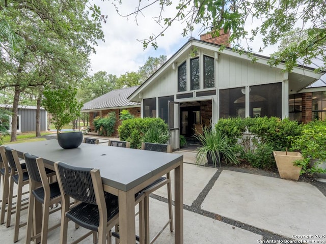 120 Spanish Oak Trl, Floresville, TX 78114 - view of patio / terrace with outdoor dining space and a sunroom