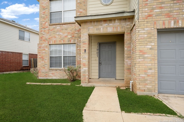 11907 Creek Peak, San Antonio, TX 78253 - view of exterior entry with brick siding and a yard