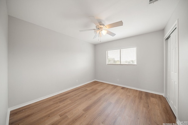 11907 Creek Peak, San Antonio, TX 78253 - unfurnished bedroom featuring light wood-type flooring, a closet, baseboards, and a ceiling fan