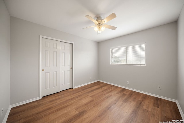 11907 Creek Peak, San Antonio, TX 78253 - unfurnished bedroom featuring baseboards, wood finished floors, a closet, and ceiling fan