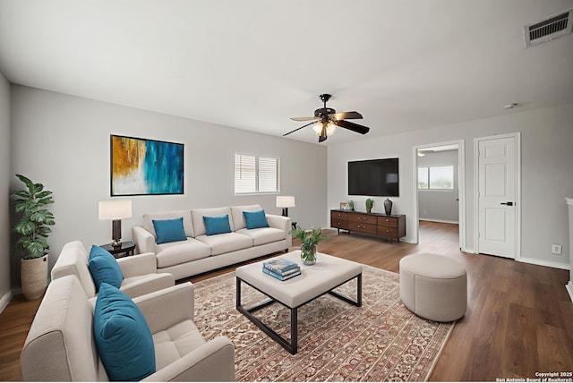 11907 Creek Peak, San Antonio, TX 78253 - living area with healthy amount of natural light, wood finished floors, a ceiling fan, and baseboards