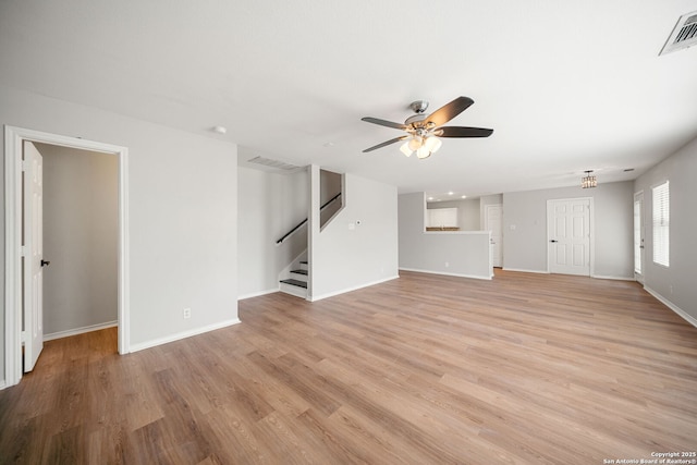 11907 Creek Peak, San Antonio, TX 78253 - unfurnished living room featuring a ceiling fan, stairway, light wood finished floors, and baseboards