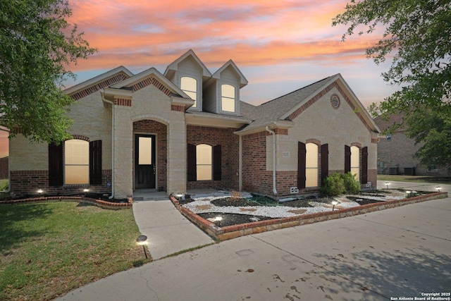 7027 Laura Hts, Schertz, TX 78154 - view of front of home featuring brick siding, a front lawn, and stone siding