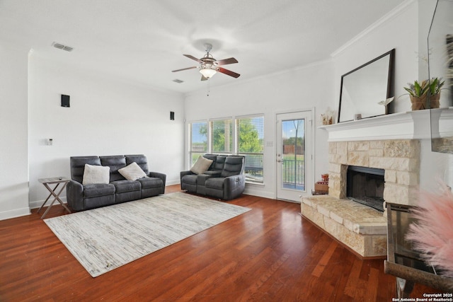 7027 Laura Hts, Schertz, TX 78154 - living room featuring ceiling fan, wood finished floors, crown molding, a fireplace, and baseboards