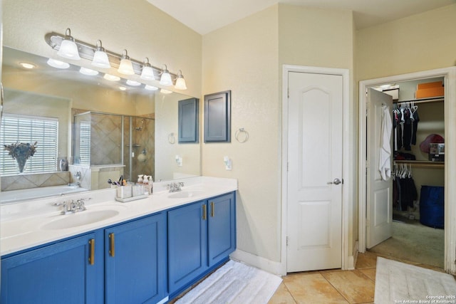 7027 Laura Hts, Schertz, TX 78154 - bathroom with a stall shower, double vanity, a walk in closet, tile patterned flooring, and a bath