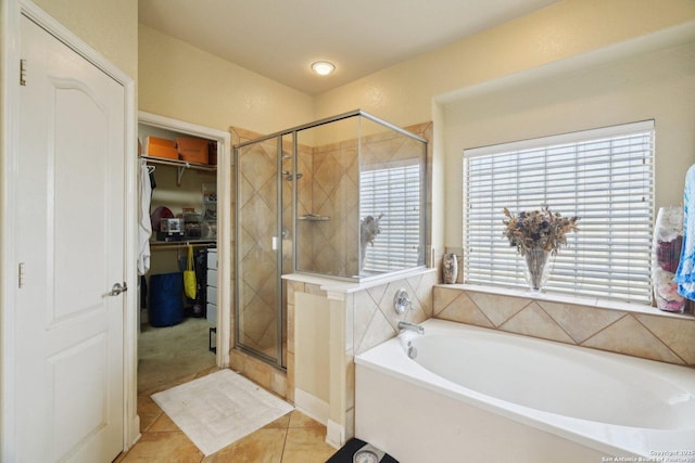 7027 Laura Hts, Schertz, TX 78154 - full bath featuring a bath, a shower stall, tile patterned flooring, and a walk in closet
