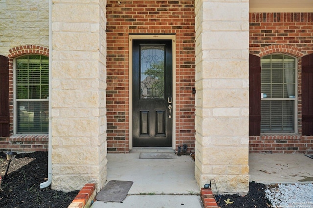 7027 Laura Hts, Schertz, TX 78154 - doorway to property with brick siding and stone siding