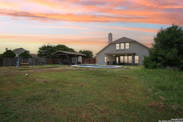 7027 Laura Hts, Schertz, TX 78154 - back of house with a gazebo, a carport, a chimney, a playground, and a patio area