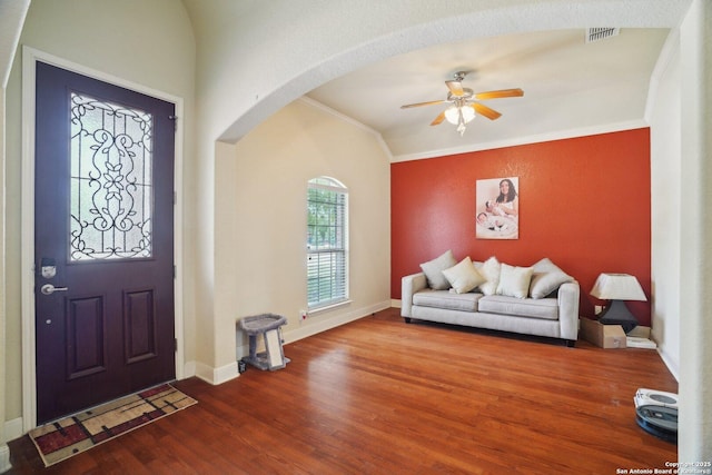 7027 Laura Hts, Schertz, TX 78154 - entryway featuring ornamental molding, arched walkways, a ceiling fan, wood finished floors, and baseboards