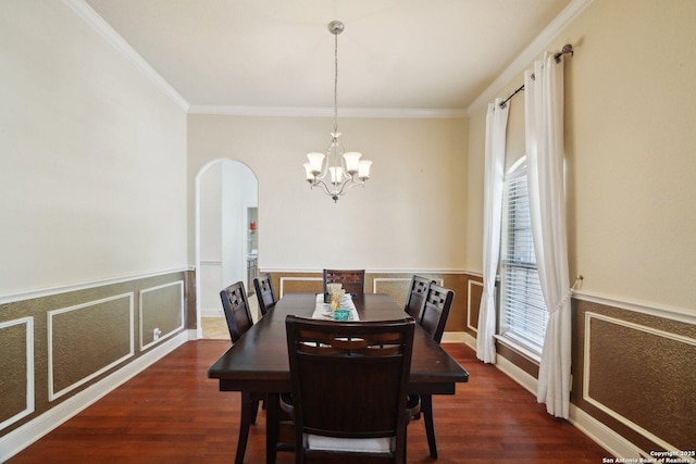 7027 Laura Hts, Schertz, TX 78154 - dining room featuring arched walkways, a chandelier, ornamental molding, wainscoting, and wood finished floors