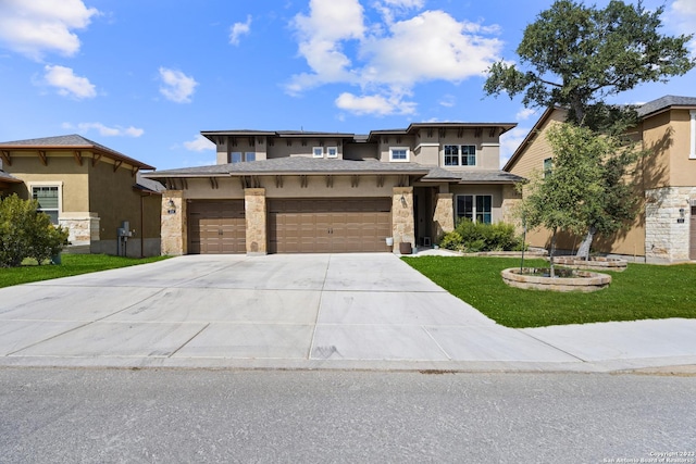 418 Sundance Way, San Antonio, TX 78253 - prairie-style home with stucco siding, concrete driveway, a garage, a front lawn, and stone siding