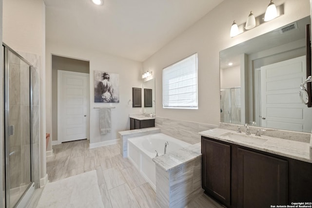 418 Sundance Way, San Antonio, TX 78253 - full bathroom featuring a stall shower, a garden tub, two vanities, and baseboards