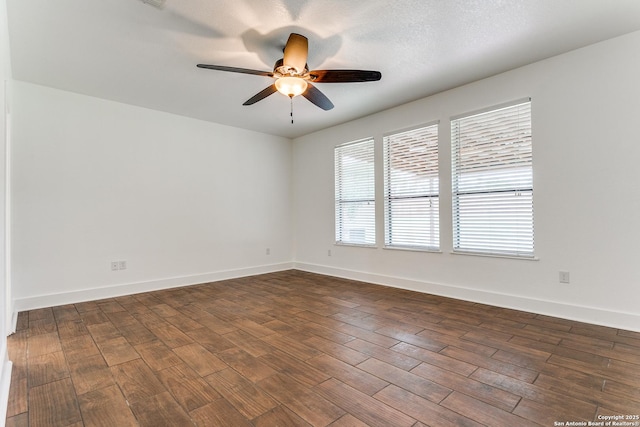 6601 Shadden Oaks, Live Oak, TX 78233 - unfurnished room featuring ceiling fan, dark wood-style floors, and baseboards