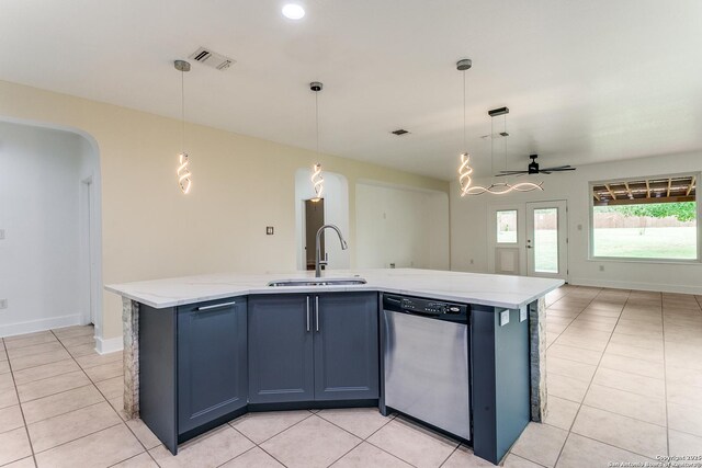 6601 Shadden Oaks, Live Oak, TX 78233 - kitchen featuring dishwasher, a sink, open floor plan, light tile patterned floors, and light stone counters