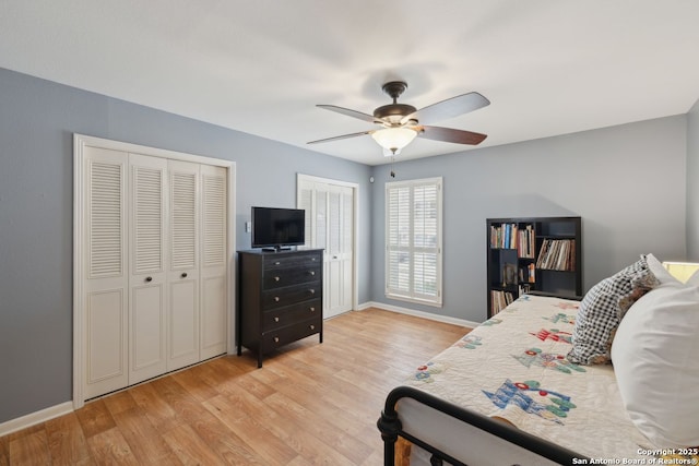 107-A Ruelle Unit 107-A, San Antonio, TX 78209 - bedroom with multiple closets, light wood finished floors, baseboards, and ceiling fan