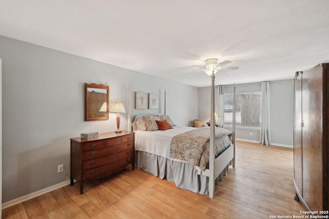 107-A Ruelle Unit 107-A, San Antonio, TX 78209 - bedroom with light wood-style floors, baseboards, and a ceiling fan