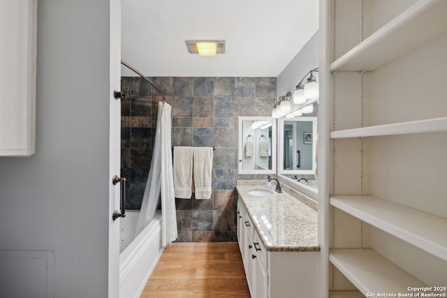 107-A Ruelle Unit 107-A, San Antonio, TX 78209 - full bathroom featuring vanity, shower / tub combo with curtain, and tile walls